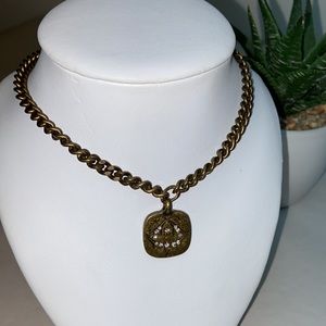 Stella & Dot chunky gold necklace with medallion, crystals